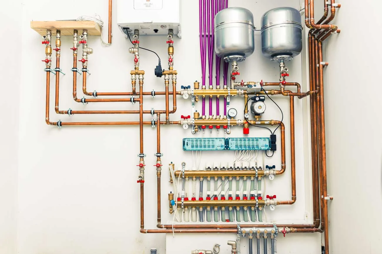 Modern heating system pipework and pump installation